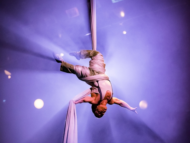 Performer Alan Silva performs astounding aerial tissu act