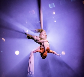 Performer Alan Silva performs astounding aerial tissu act