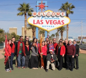 AFAN Executives and community members turn "Welcome to Fabulous Las Vegas Sign Red