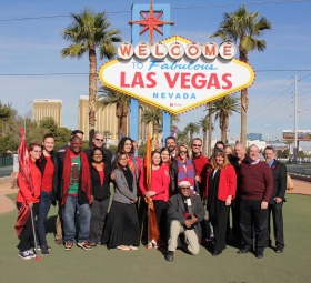 AFAN Executives and community members turn "Welcome to Fabulous Las Vegas Sign Red